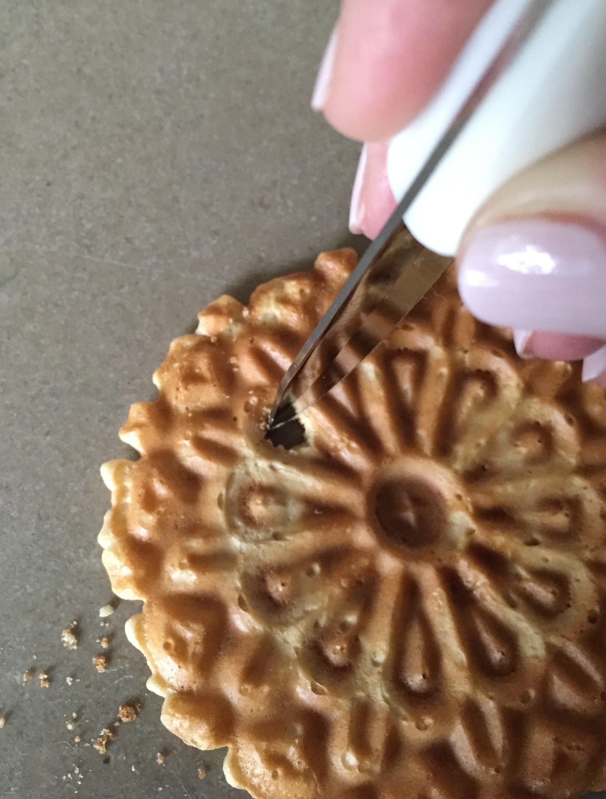 making a straw hole in a cookie